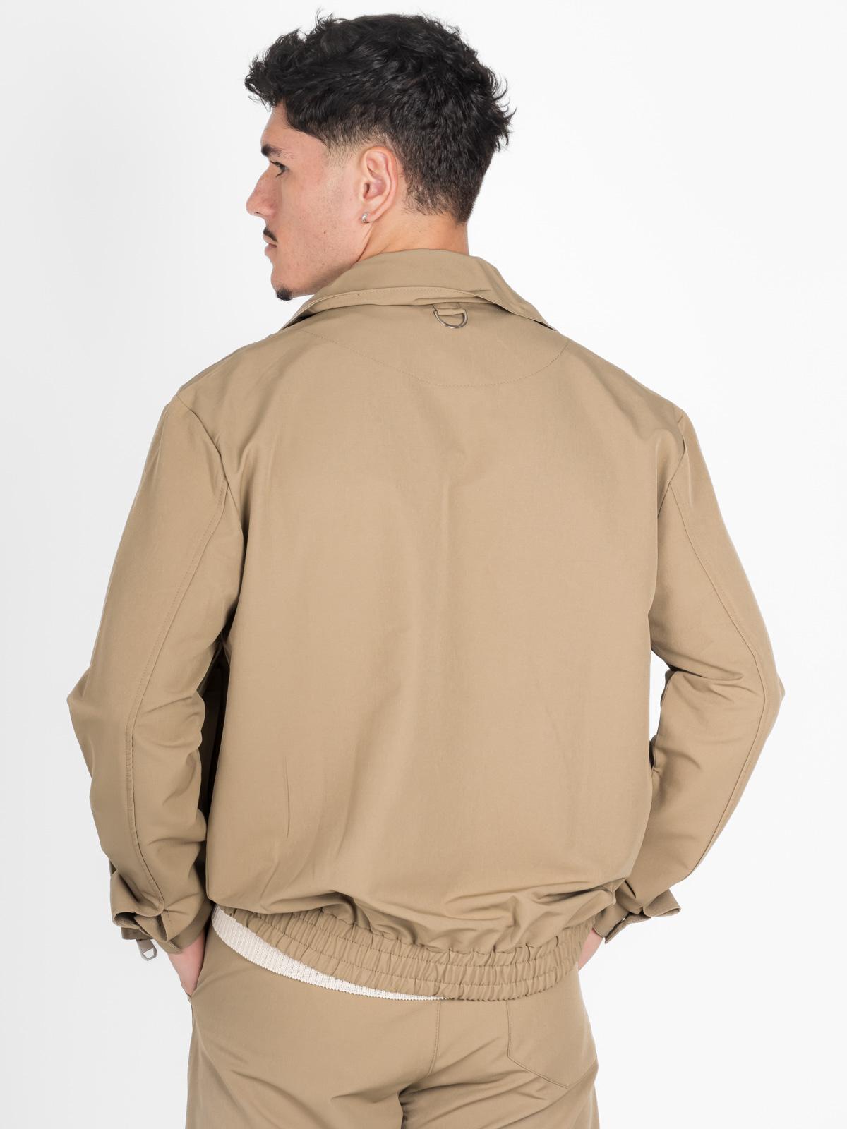 Set pantaloni e giacca beige